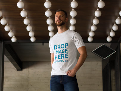 T-Shirt Mockup of a Man at a Modern Restaurant