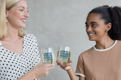 Mockup of Two Women Toasting with Stemless Wine Glasses 27950