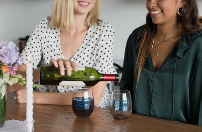 Stemless Wine Glass Mockup Featuring Two Friends At a Table 27954
