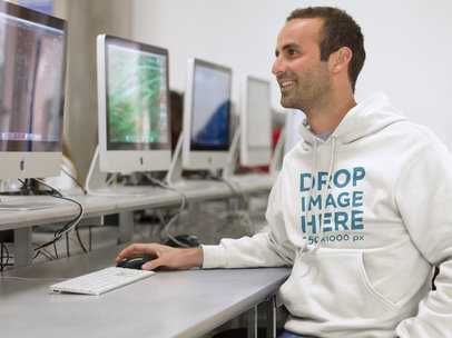 Smiling Student in Computer Lab Hoodie Mockup a8694