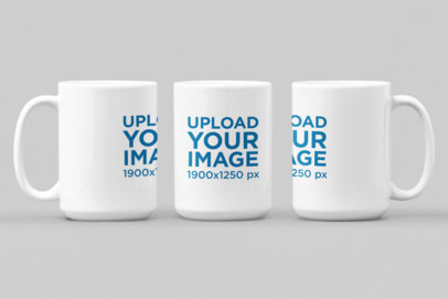 Mockup of Three Different-Angled 15 oz Mugs Against a Flat Environment