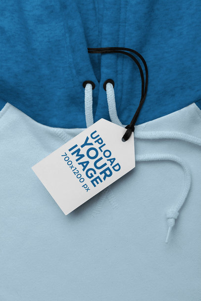 Mockup of a Brand Tag Attached to a Pullover Hoodie