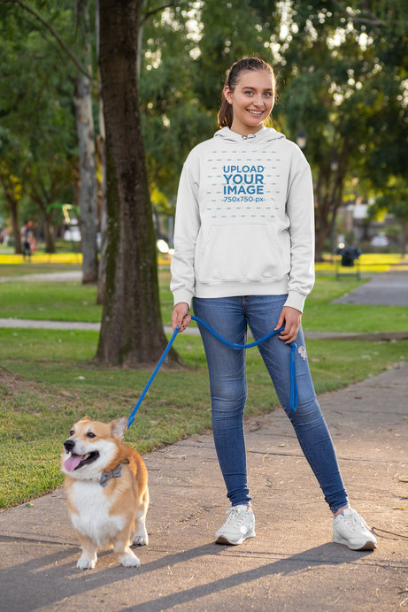 Pullover Hoodie Mockup of a Woman Walking Her Dog at the Park