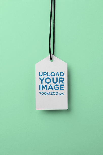 Brand Tag Mockup Hanging Against a Flat Background