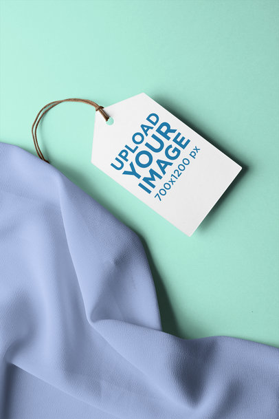 Clothing Tag Mockup Attached to a Blouse's Sleeve