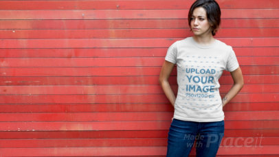 T-Shirt Video Featuring a Young Woman in Front of a Red Wooden Wall 12150