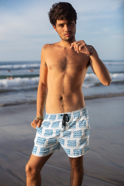 Mockup of a Man Wearing Swim Trunks at the Beach