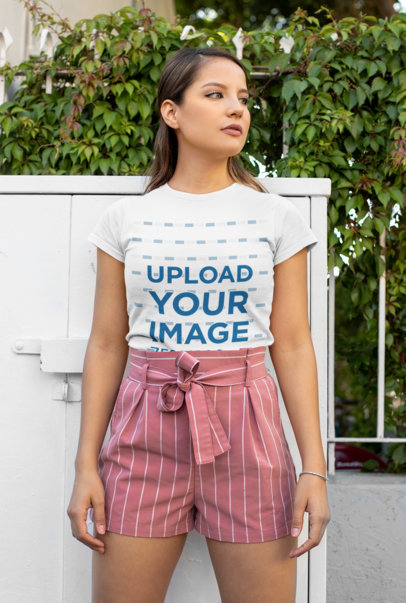Mockup of a Woman Wearing a Tucked T-Shirt with Shorts