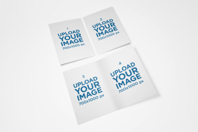 Mockup of Two Bi-Fold A5 Brochures Lying Over a Flat Surface