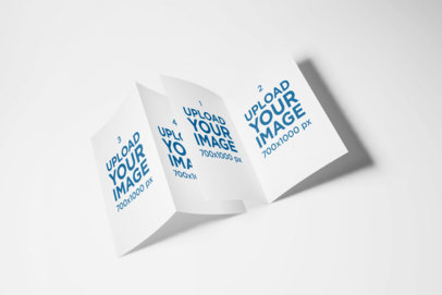 Mockup of Two A5 Bi-Fold Brochures Lying By Each Other