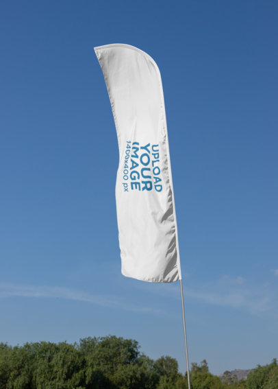 Mockup of a Flag Banner Against a Clear Sky
