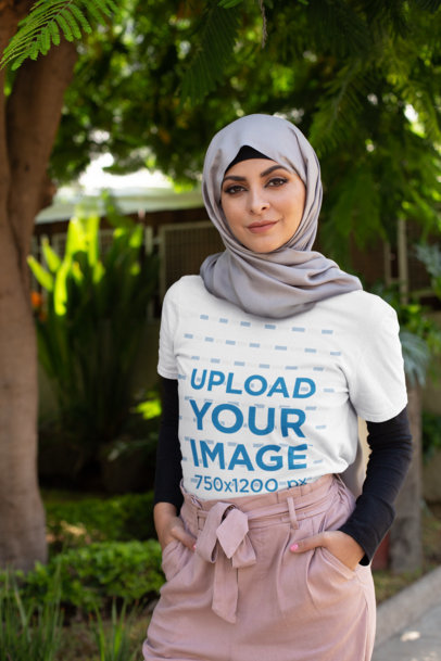 T-Shirt Mockup of a Woman Wearing a Hijab at the Park