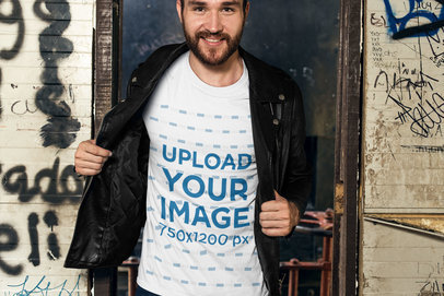 T-Shirt Mockup of a Man Against a Graffiti Wall 