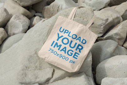 Mockup Featuring a Tote Bag Surrounded by Rocks 107-el