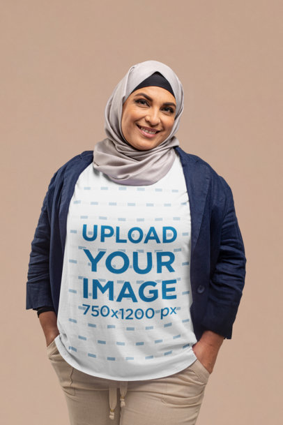 T-Shirt Mockup of a Woman Wearing a Hijab and Looking at the Camera at a Studio