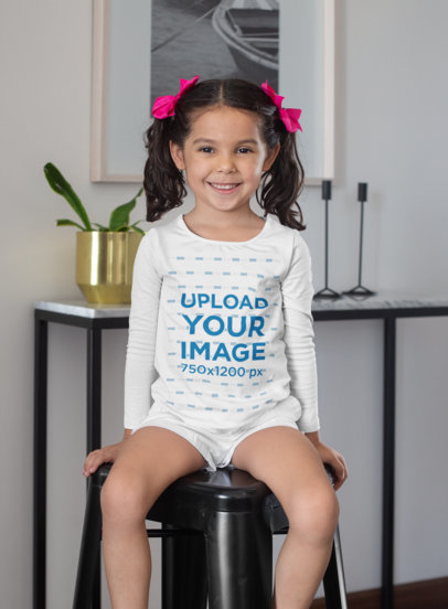Long Sleeve Tee Mockup of a Smiling Girl Sitting on a Modern Stool