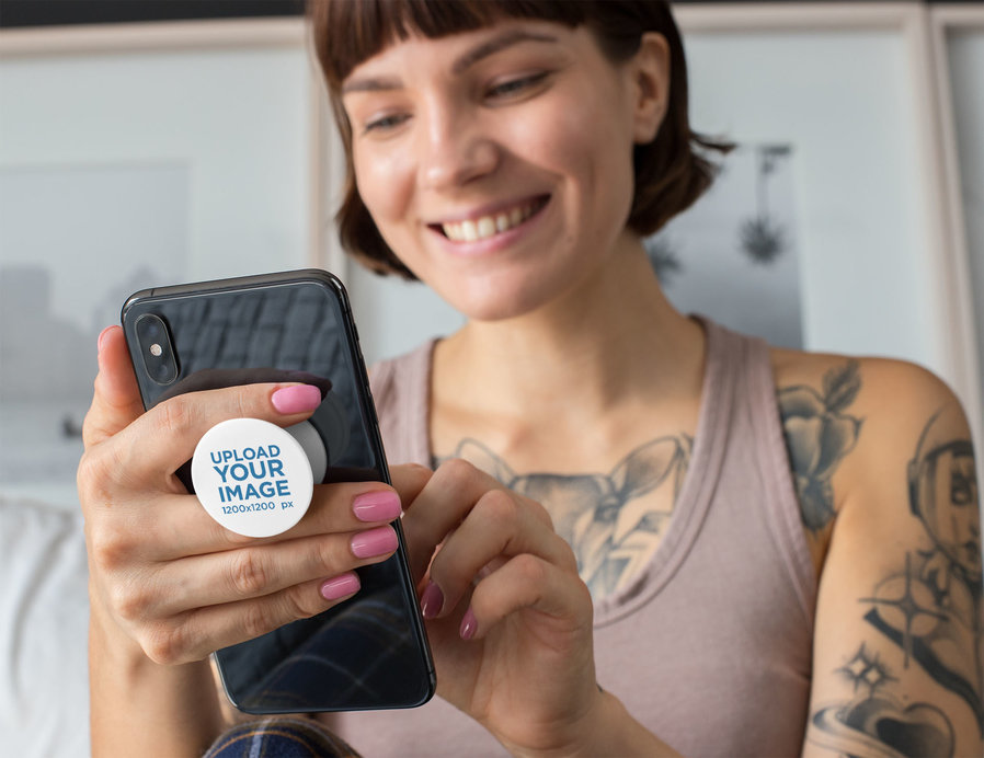 Phone Grip Mockup of a Smiling Short-Haired Woman Looking at Her Phone 