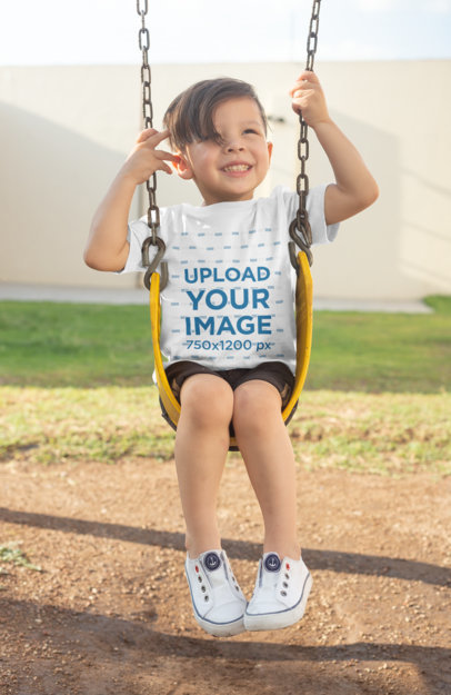 T-Shirt Mockup of a Boy Playing on a Swing