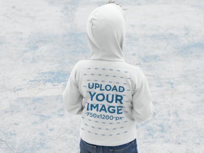 Back of a Small Kid Wearing a Pullover Hoodie Mockup During Winter