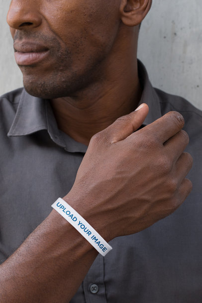 Mockup of a Man Showing off His Silicone Wristband