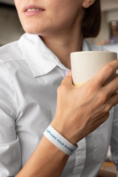 Paper Wristband Mockup Featuring a Woman Holding a Coffee Cup 