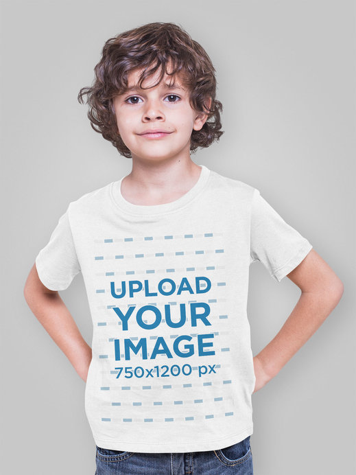 T-Shirt Mockup of a Boy Posing in a Studio