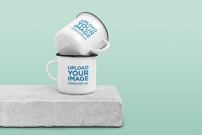 Mockup Featuring Two 12 oz Enamel Mugs on a Concrete Block