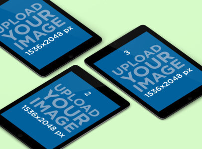 Mockup Featuring Three iPads in Portrait Position Over a Solid Color Surface