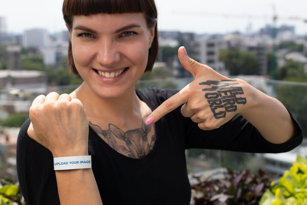 Mockup of a Woman Showing off Her Paper Wristband