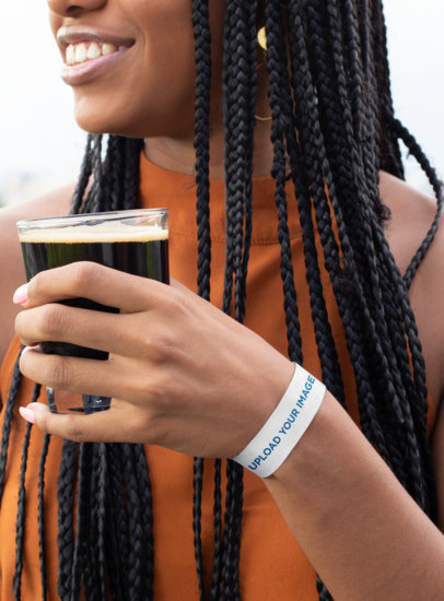 Paper Wristband Mockup Featuring a Woman Holding a Beer