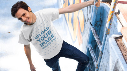 T-Shirt Video of a Man Hanging from an Empty Pool's Ladder