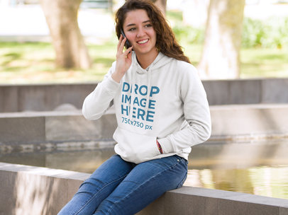 Girl at School Making a Phone Call Hoodie Mockup a9184