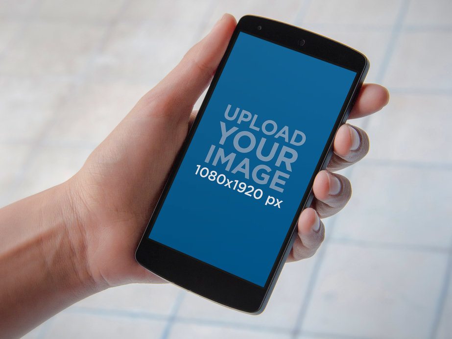 Mockup of a Man Holding a Nexus 5