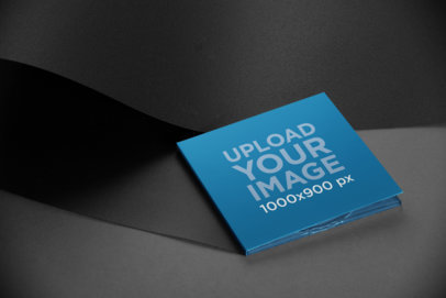 Mockup of a Digipak Lying Against a Monochromatic Background