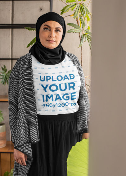 T-Shirt Mockup of a Senior Woman Wearing a Hijab 