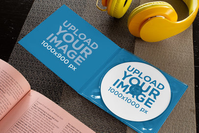 Digipak Mockup with a CD and Headphones