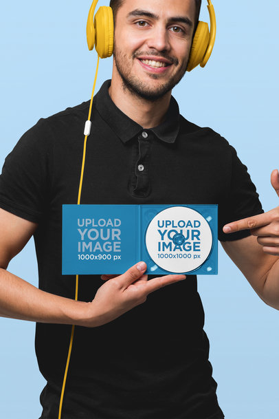 Mockup of a Man Showing a Digipak