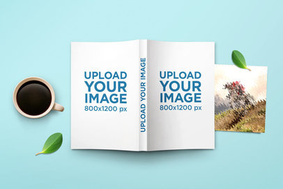 Mockup of an Open Softcover Book Lying Upside Down Next to a Coffee 302-el