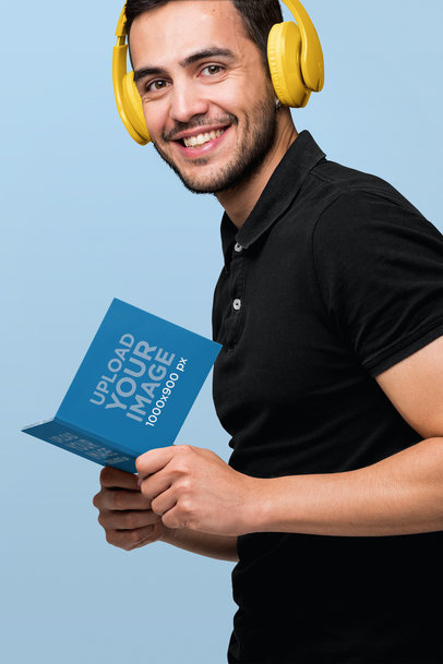 Digipak Mockup Featuring a Smiling Man Wearing Headphones