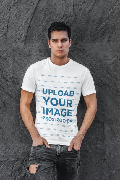 T-Shirt Mockup Featuring a Man Standing Against a Dark Wall 