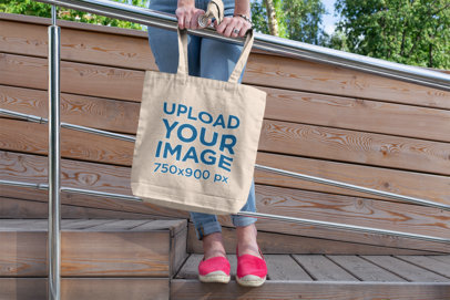 Tote Bag Mockup of a Woman Leaning on a Metal Handrail 194-el