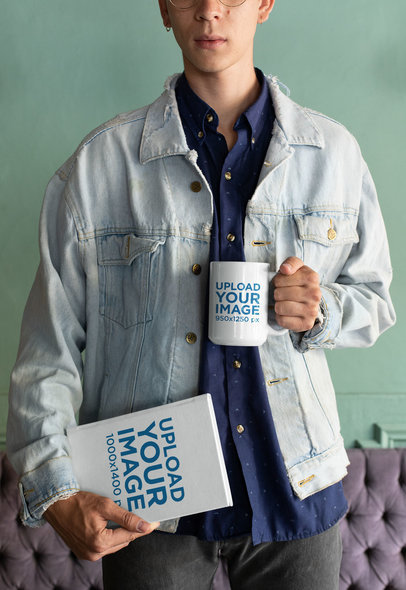 Mockup of a Man Holding a Coffee Mug and a Book