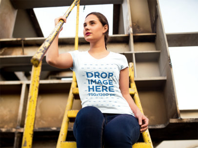 Woman Sitting on a Metallic Staircase T-Shirt Mockup