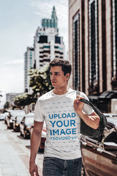 T-Shirt Mockup Featuring a Young Man with a Backpack on his Shoulder 