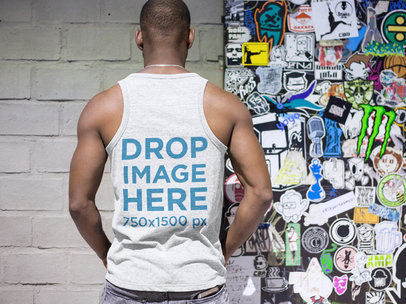Back of a Man Wearing a Tank Top While in a Subway Station