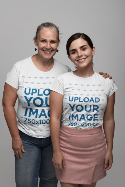 T-Shirt Mockup of Mother and Daughter Posing in a Studio