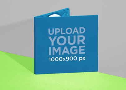 Mockup of a Digipak Standing Over Two Colored Papers 28346