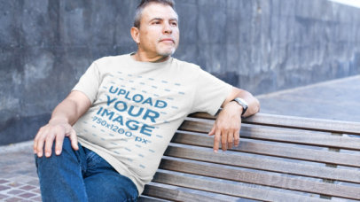 T-Shirt Video of a Mature Man Sitting on a Street Bench