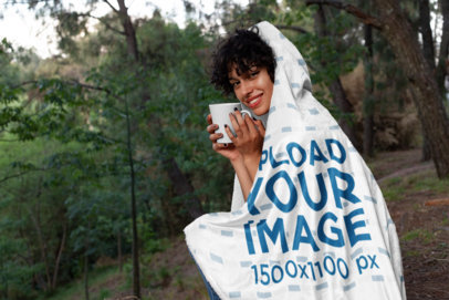 Hooded Fleece Blanket Mockup of a Girl Having a Coffee in the Woods  28147