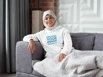 Mockup of a Woman with a Hijab Lying on a Sofa 